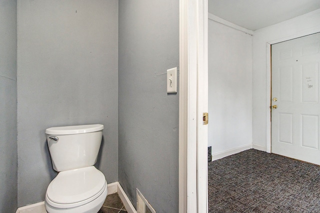 bathroom featuring tile patterned flooring and toilet