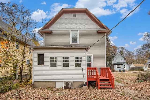 back of house featuring a deck