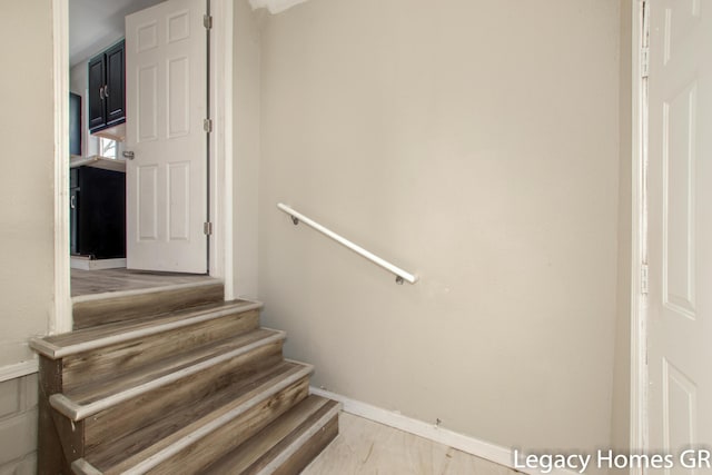 staircase featuring hardwood / wood-style flooring