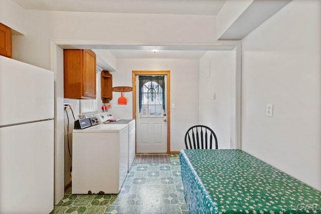 interior space featuring washing machine and dryer and light hardwood / wood-style floors