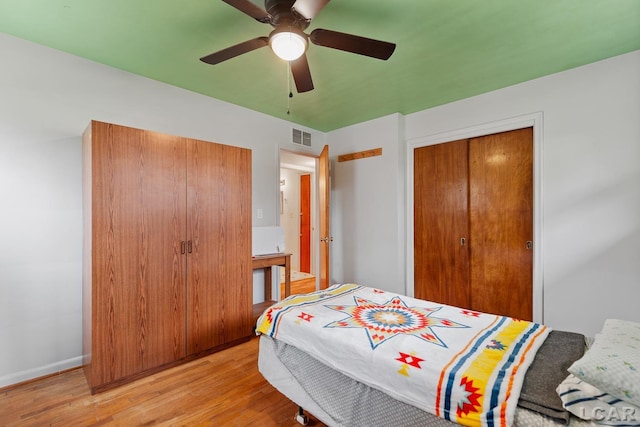 bedroom featuring ceiling fan, a closet, and light hardwood / wood-style flooring