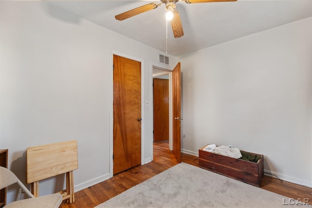 bedroom featuring ceiling fan and hardwood / wood-style flooring