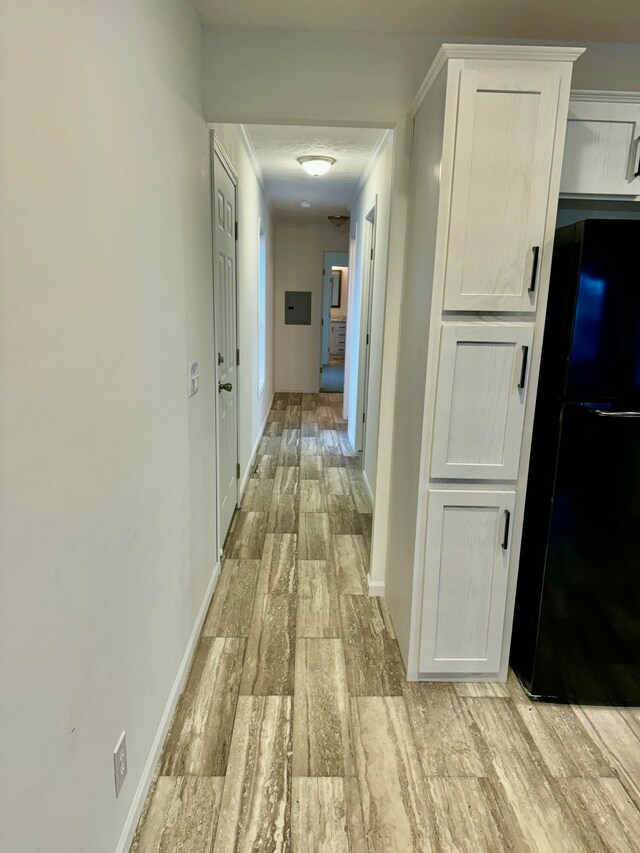 hall with light hardwood / wood-style floors