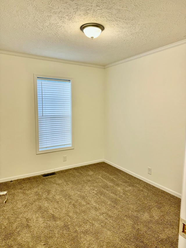 empty room featuring carpet flooring, a textured ceiling, and crown molding