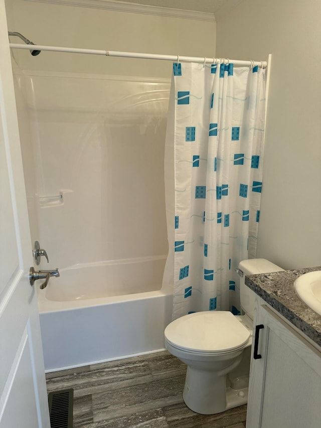 full bathroom featuring vanity, toilet, shower / bathtub combination with curtain, ornamental molding, and wood-type flooring