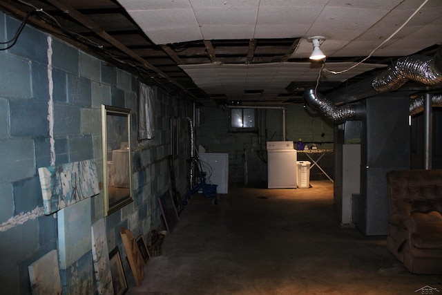 basement with washer / dryer and heating unit