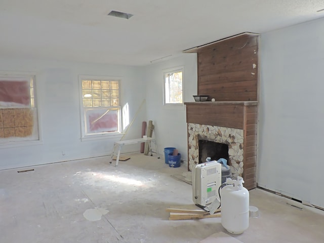 living room featuring a fireplace