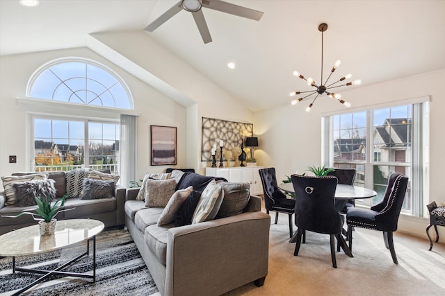 living room featuring light carpet, a healthy amount of sunlight, and lofted ceiling