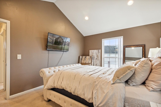 bedroom with light carpet and vaulted ceiling