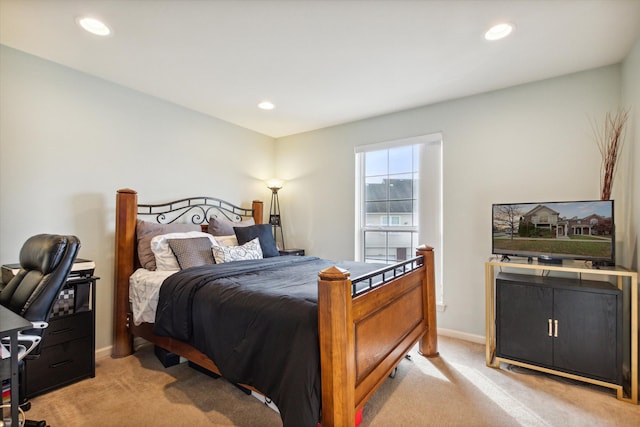 bedroom featuring light colored carpet