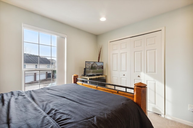 carpeted bedroom featuring a closet