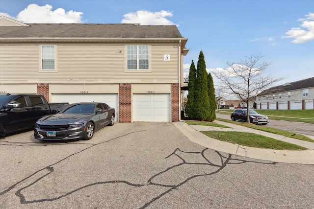 view of side of property with a garage