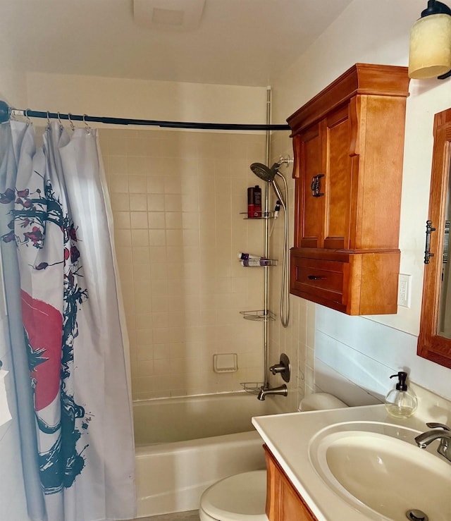 bathroom with vanity, toilet, and shower / tub combo