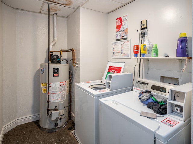 laundry area with gas water heater and washing machine and clothes dryer