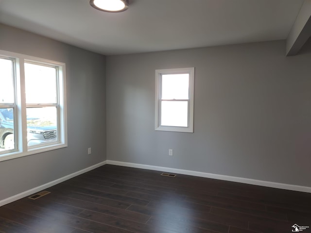 113 Walnut St, Brooklyn, MI 49230 - empty room featuring baseboards and dark wood-style flooring