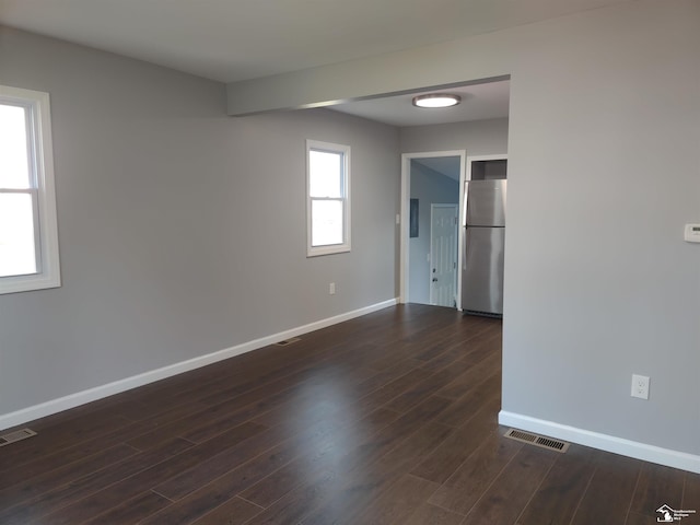 113 Walnut St, Brooklyn, MI 49230 - unfurnished room featuring baseboards and dark wood-type flooring