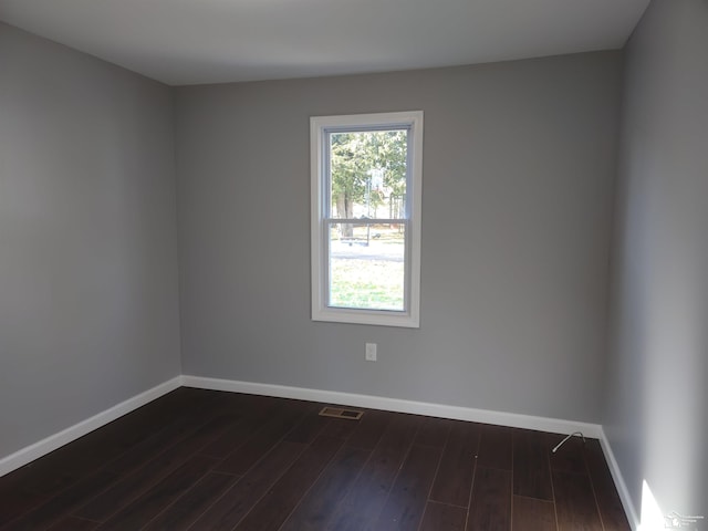 113 Walnut St, Brooklyn, MI 49230 - empty room with baseboards and dark wood-type flooring