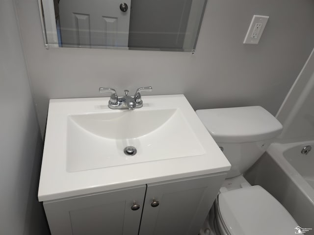 113 Walnut St, Brooklyn, MI 49230 - bathroom featuring toilet, vanity, and a bath