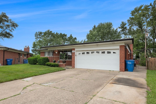 single story home with a front yard and a garage