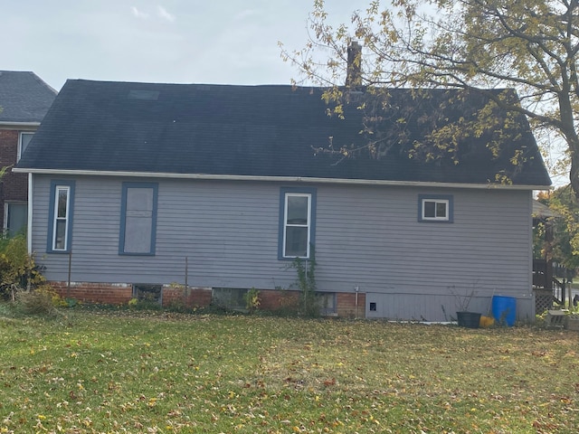 view of side of home featuring a yard