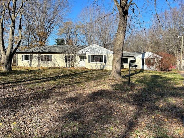 ranch-style house with a front lawn