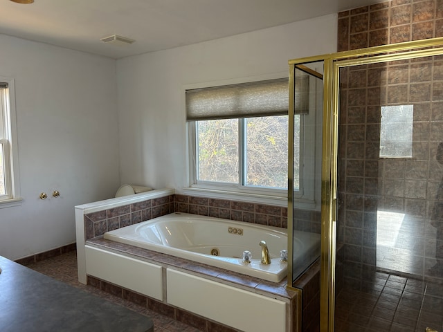 bathroom with independent shower and bath