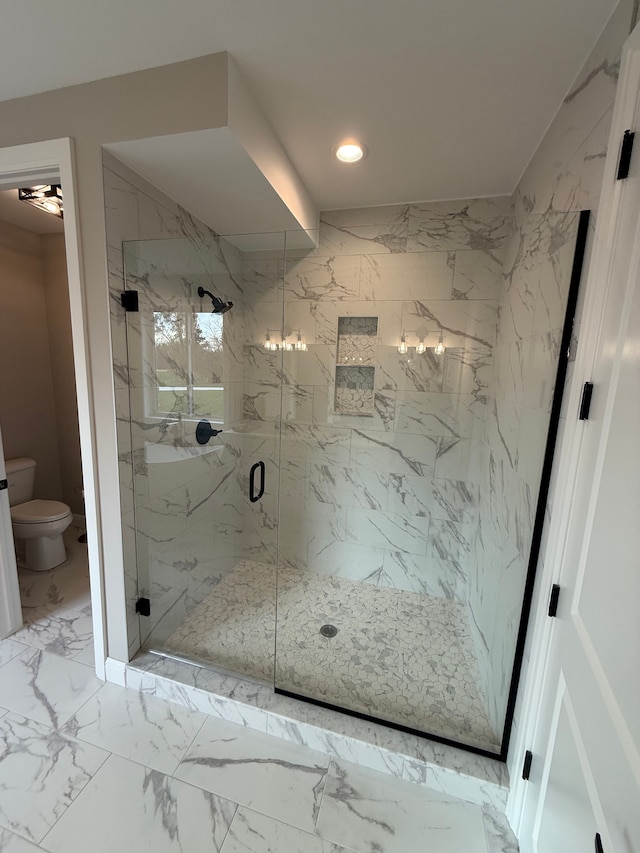 bathroom featuring toilet, an inviting chandelier, and walk in shower