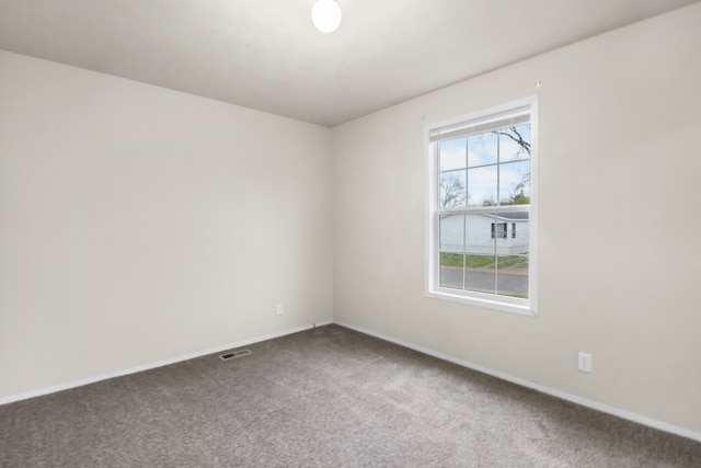 unfurnished room with carpet floors