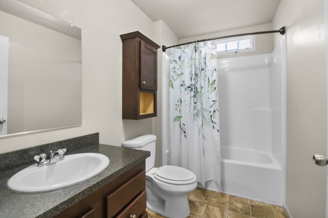 full bathroom with tile patterned flooring, vanity, shower / bath combo, and toilet