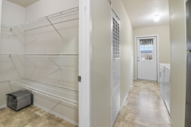 interior space with washer and clothes dryer