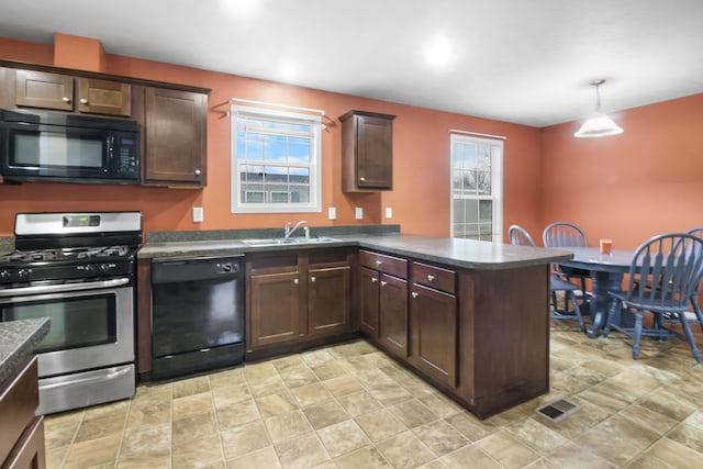 kitchen featuring dark brown cabinetry, sink, hanging light fixtures, kitchen peninsula, and black appliances