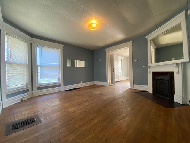 unfurnished living room featuring hardwood / wood-style floors