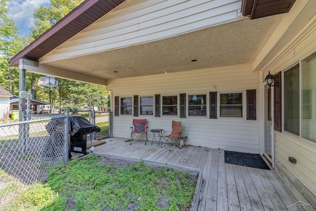 wooden deck featuring area for grilling