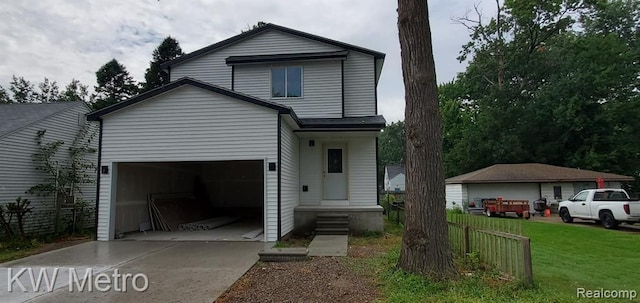 front facade with a garage and a front lawn