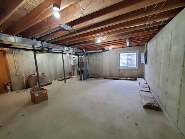 basement with heating unit and electric panel