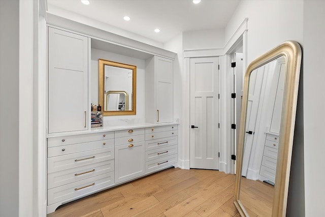 bathroom featuring wood-type flooring and vanity