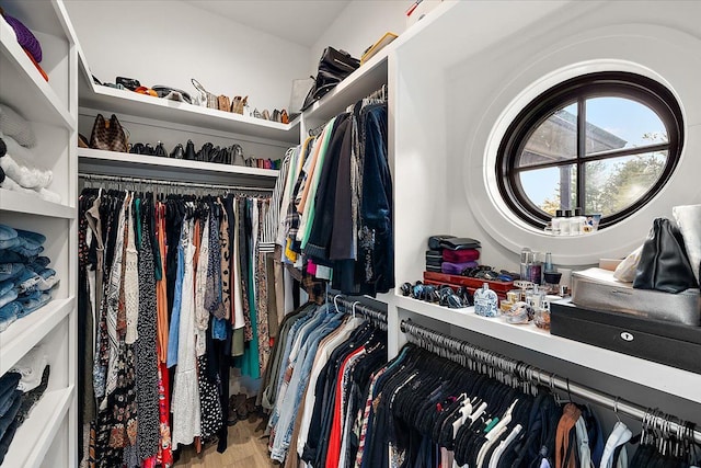 spacious closet with light hardwood / wood-style floors