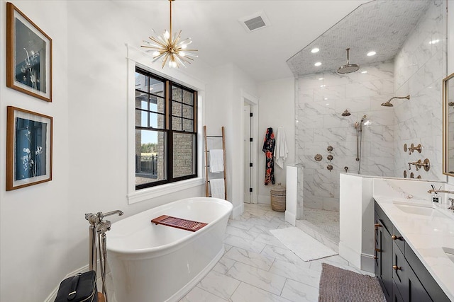 bathroom with vanity, shower with separate bathtub, and a chandelier