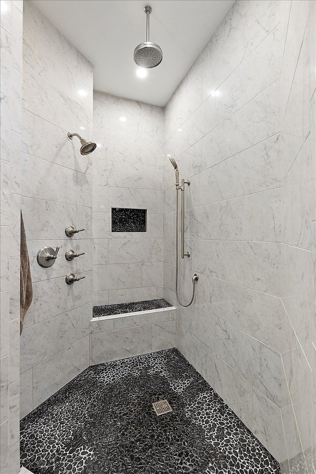 bathroom with tiled shower