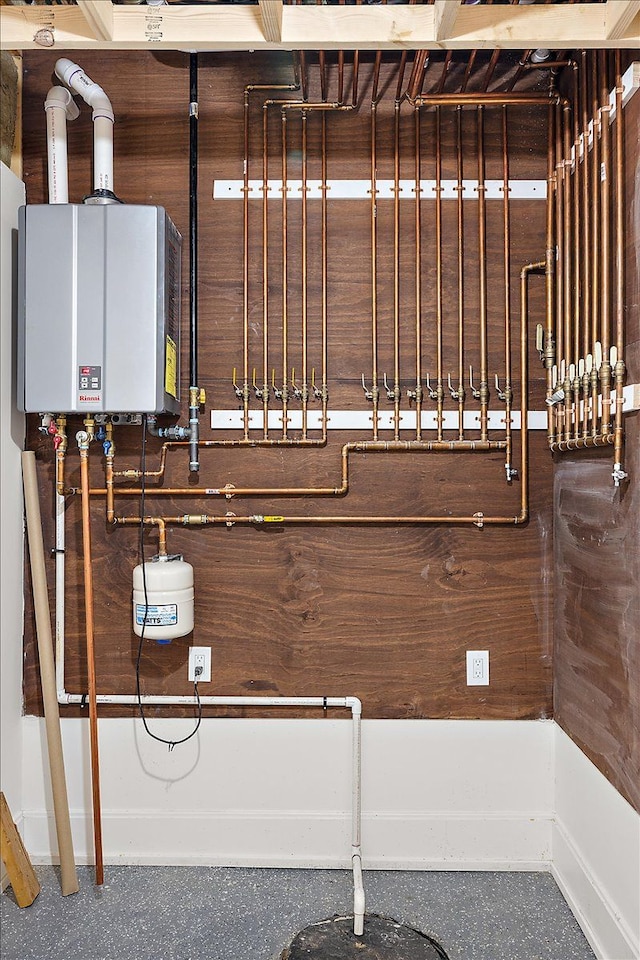 utility room featuring water heater