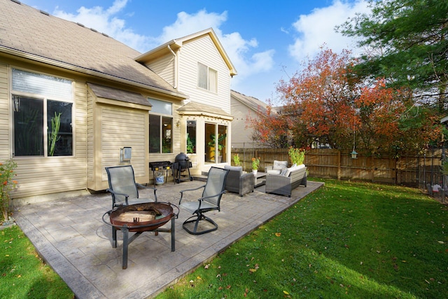 view of patio featuring an outdoor living space with a fire pit