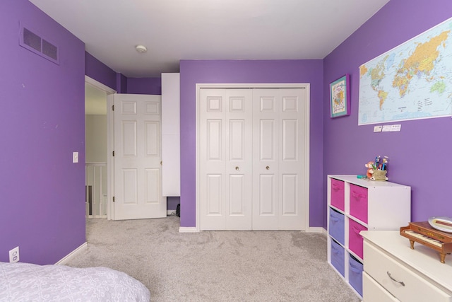 carpeted bedroom featuring a closet