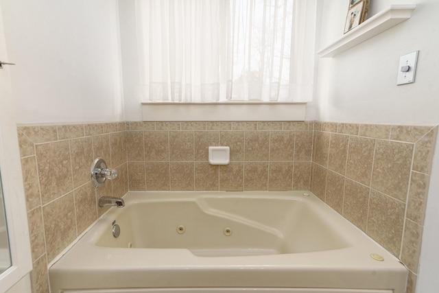 bathroom featuring a tub to relax in