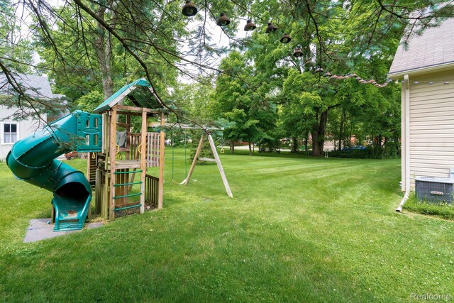 230 E Elizabeth St, Lake Orion, MI 48362 - view of green lawn with a playground