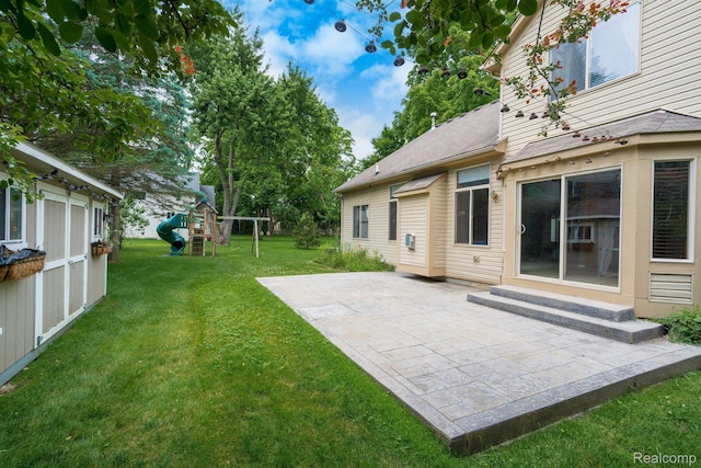 230 E Elizabeth St, Lake Orion, MI 48362 - view of grassy yard with a patio, a playground, and entry steps