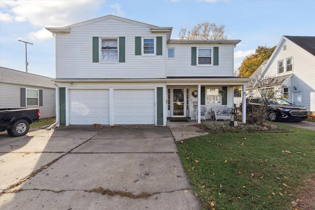 view of property with covered porch, a front yard, and a garage