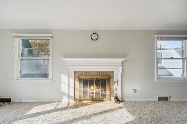 details featuring carpet floors and a brick fireplace