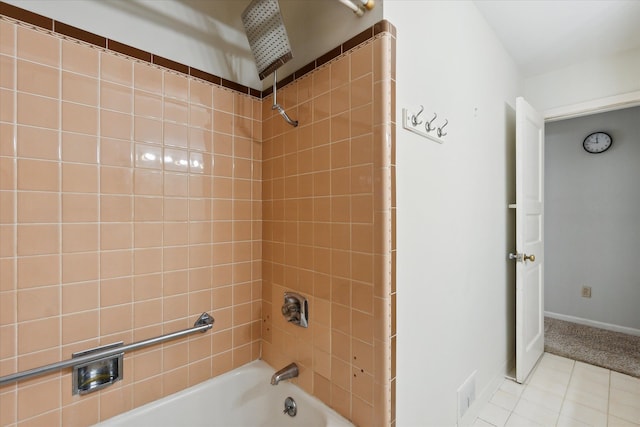 bathroom with tile patterned flooring and tiled shower / bath combo