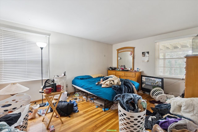 bedroom with hardwood / wood-style flooring