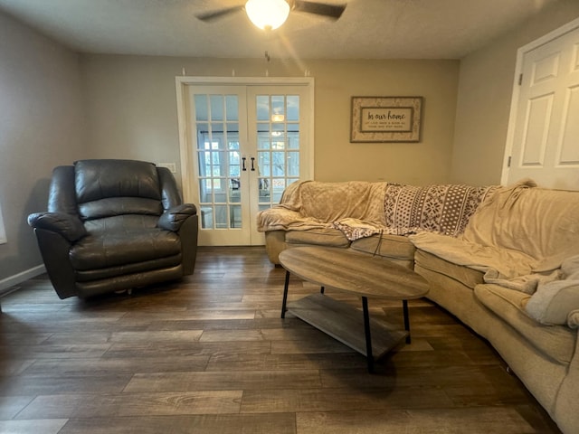 living room featuring dark hardwood / wood-style floors, french doors, and ceiling fan